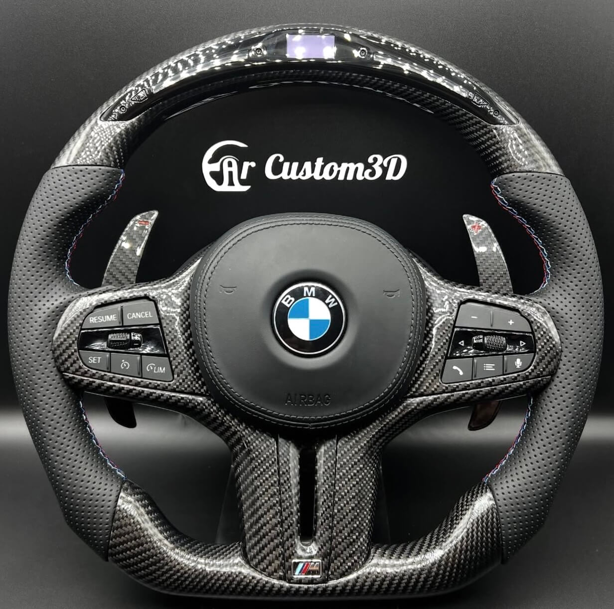 Volant BMW sport personnalisé avec méplat carbone
